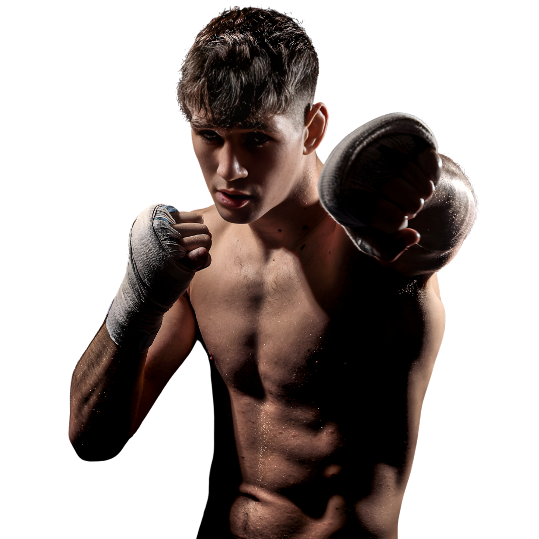 Dramatic studio portrait of Liam Walsh throwing a punch towards camera